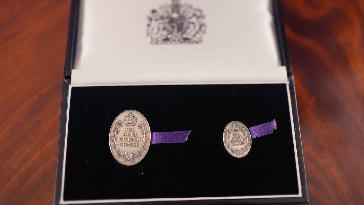 Family of 21-year-old paramedic who died in ambulance crash honoured by the King