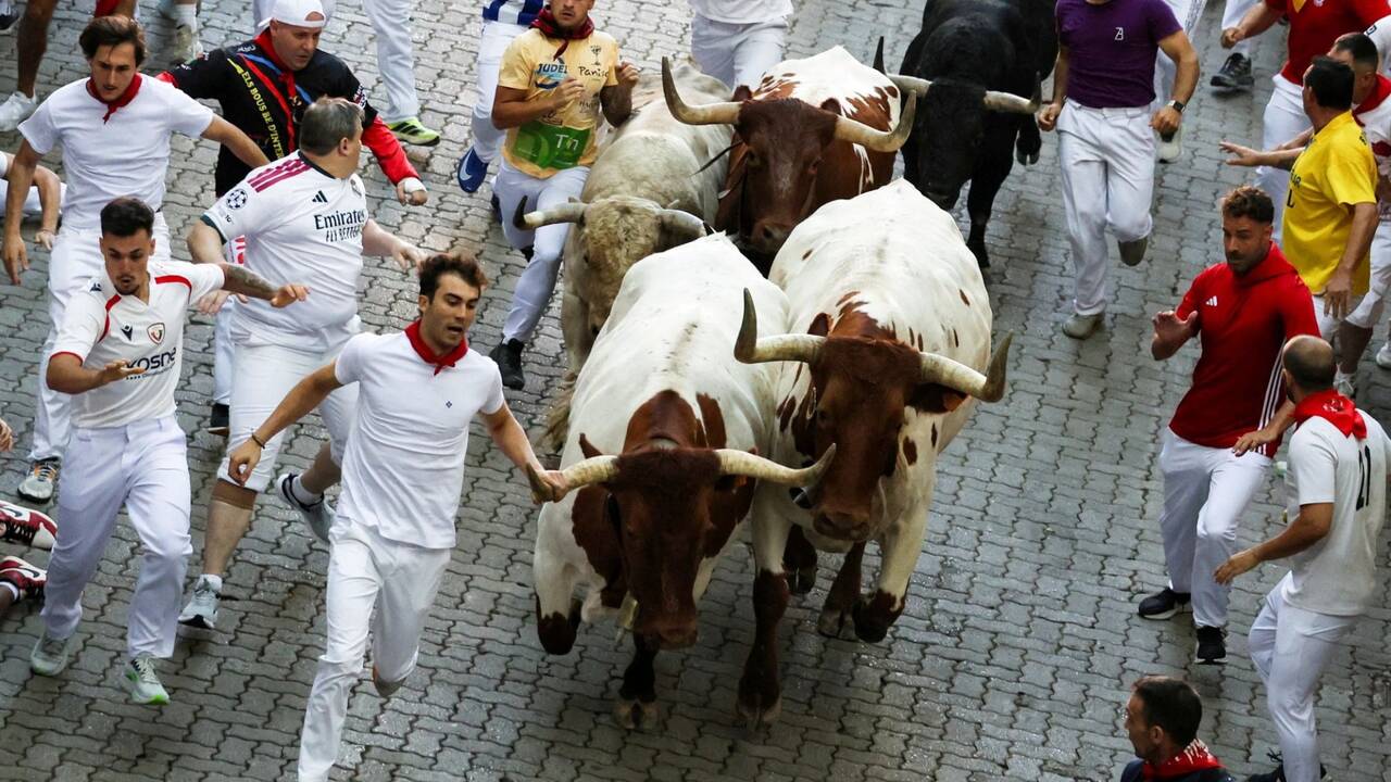 First injuries from famed Pamplona bull run as three rushed to hospital &ndash; hours after attendee collapses in bar and dies