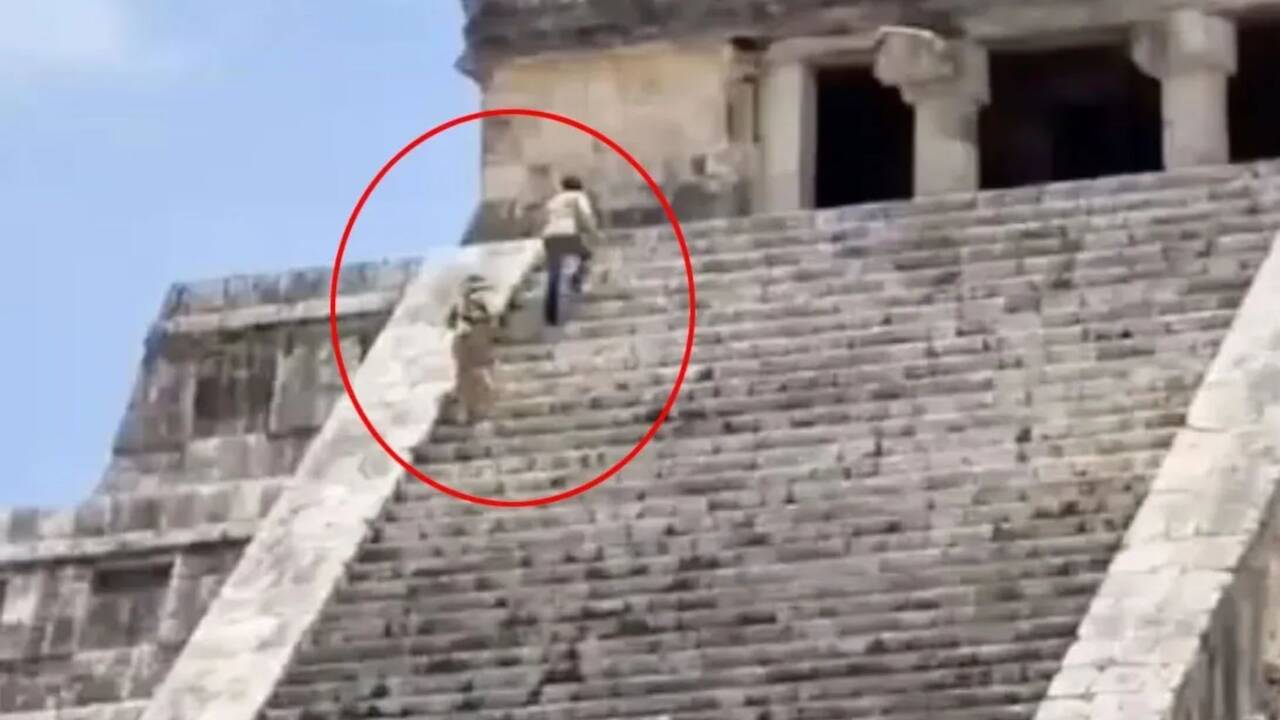 Shocking moment tourists brazenly scale iconic ancient pyramid before being arrested & face huge fine