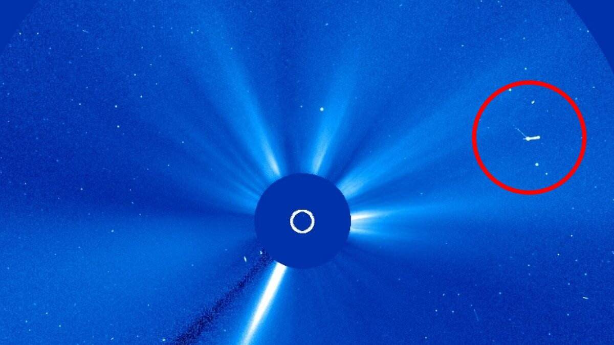 Giant 'UFO mothership' spotted shooting across Earth's sun at 'near light speed', claims UFOlogist